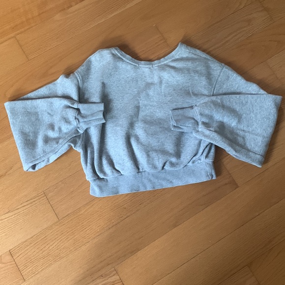 This is a Garage cropped gray sweater. With a white flower stitch design. - Picture 3 of 4